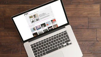 Aufgeklappter Laptop mit Ansicht der 99Edition Website