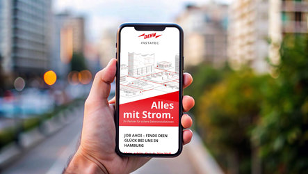 Handy mit Dehn-HP, Hintergrund Stadtbild