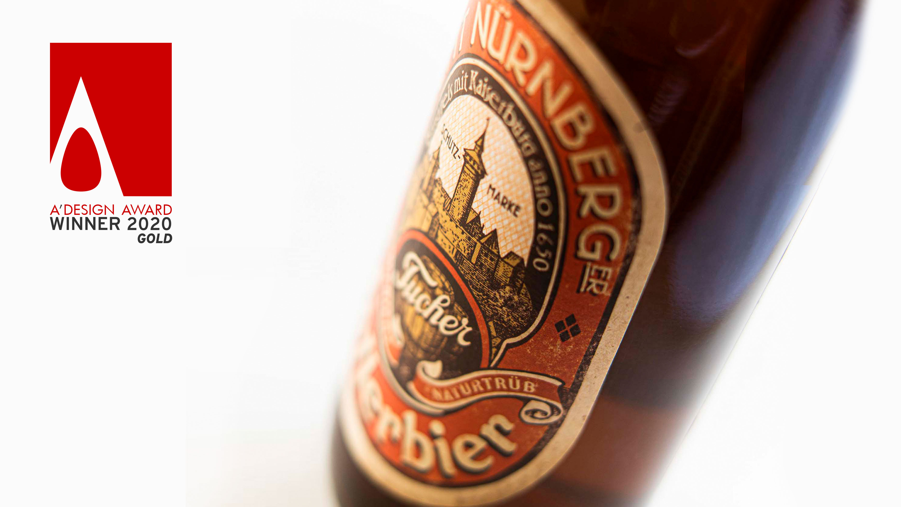 Bild vom Tucher AEcht Nürnberger Kellerbier mit dem A‘ Design Award Logo